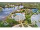 Aerial view of community center, pool, tennis courts, and lake at 5265 Forest Edge Ct, Sanford, FL 32771