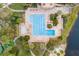 Aerial view of community pool with lap lanes, spa, and surrounding landscaping at 5265 Forest Edge Ct, Sanford, FL 32771