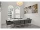 Bright dining room with large windows and modern chandelier at 5265 Forest Edge Ct, Sanford, FL 32771