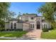 Stunning two-story home with brick driveway and manicured landscaping at 5265 Forest Edge Ct, Sanford, FL 32771