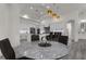 Modern kitchen with white cabinets and marble island at 5265 Forest Edge Ct, Sanford, FL 32771