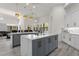 Modern kitchen with large island and breakfast bar at 5265 Forest Edge Ct, Sanford, FL 32771