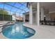 Inviting freeform pool with spa and waterfall feature at 5265 Forest Edge Ct, Sanford, FL 32771