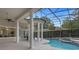 Resort-style pool area with covered patio and lush landscaping at 5265 Forest Edge Ct, Sanford, FL 32771