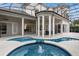 Relaxing pool and spa area with covered patio and seating at 5265 Forest Edge Ct, Sanford, FL 32771