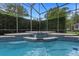 Inviting screened pool area with waterfall feature and spacious deck at 5265 Forest Edge Ct, Sanford, FL 32771