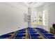 Bright prayer room with blue rug and built-in shelving at 5265 Forest Edge Ct, Sanford, FL 32771