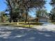 House exterior view from across the street, showcasing curb appeal at 5581 Aeolus Way, Orlando, FL 32808