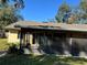 House exterior with screened patio at 5581 Aeolus Way, Orlando, FL 32808