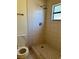 Simple shower stall with tiled walls at 5581 Aeolus Way, Orlando, FL 32808