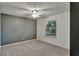 Bright bedroom with neutral walls and ceiling fan at 601 Kelly Green St, Oviedo, FL 32765