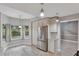 Bright kitchen with stainless steel appliances and white cabinets at 601 Kelly Green St, Oviedo, FL 32765