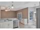 Modern kitchen with stainless steel appliances and white cabinets at 601 Kelly Green St, Oviedo, FL 32765