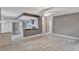 Spacious living room featuring light grey walls and wood-look floors at 601 Kelly Green St, Oviedo, FL 32765