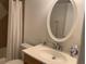 Bathroom sink with mirror and toilet at 6073 Windhover Dr # C04, Orlando, FL 32819