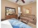 Bedroom with a large mirror and comfortable sofa for relaxing at 686 Lake Villas Dr # 686, Altamonte Springs, FL 32701