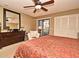 Comfortable bedroom with dresser, closet, and natural light from sliding glass doors at 686 Lake Villas Dr # 686, Altamonte Springs, FL 32701