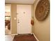 Condo entrance with a decorative wall piece and a white door at 686 Lake Villas Dr # 686, Altamonte Springs, FL 32701