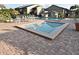 Community pool area with a rectangular spa, lounge chairs, and umbrella tables on a brick-paved deck at 686 Lake Villas Dr # 686, Altamonte Springs, FL 32701