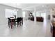 Open concept dining area with seating for four and views to the living room at 776 Rioja Dr, Minneola, FL 34715