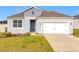 Curb appeal abounds in this charming one-story home, featuring a two-car garage at 776 Rioja Dr, Minneola, FL 34715