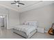 King bedroom with large window and ceiling fan at 803 Fraser Dr, Poinciana, FL 34759