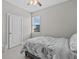 Bright bedroom with a double bed and window at 803 Fraser Dr, Poinciana, FL 34759