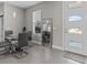 Bright dining area with glass table and gray chairs at 803 Fraser Dr, Poinciana, FL 34759