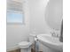 Small bathroom with toilet and pedestal sink at 8156 Elion St, Orlando, FL 32827