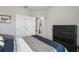 Bright bedroom with double bed, dresser and access to bathroom at 9737 Amber Chestnut Way, Winter Garden, FL 34787