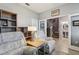 Versatile bonus room with comfortable seating, built-in shelving, and access to additional rooms at 9737 Amber Chestnut Way, Winter Garden, FL 34787