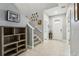 Bright entryway with staircase and built-in shelving at 9737 Amber Chestnut Way, Winter Garden, FL 34787