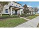 Townhome exterior showcasing a walkway and landscaping at 9737 Amber Chestnut Way, Winter Garden, FL 34787