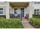 Cozy front porch with seating area and brick walkway at 9737 Amber Chestnut Way, Winter Garden, FL 34787