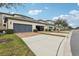 Row of attached garages with brick pavers and ample parking space at 9737 Amber Chestnut Way, Winter Garden, FL 34787