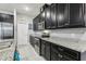 Well-equipped kitchen with dark wood cabinets at 9737 Amber Chestnut Way, Winter Garden, FL 34787