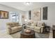 Relaxing living room featuring comfy sofas and a coffee table at 9737 Amber Chestnut Way, Winter Garden, FL 34787