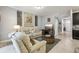 Open living room with a view into the kitchen area at 9737 Amber Chestnut Way, Winter Garden, FL 34787