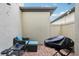 Private patio with brick paving, wicker furniture, and grill at 9737 Amber Chestnut Way, Winter Garden, FL 34787