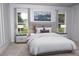 Bright bedroom with large windows, plush bedding and neutral decor at 10118 Allenby Ct, Orlando, FL 32821