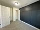 Spacious bedroom with dark-accent wall and ample closet space at 10118 Allenby Ct, Orlando, FL 32821