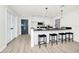 Stylish kitchen with a breakfast bar, modern appliances, and easy access to dining and other living spaces at 10118 Allenby Ct, Orlando, FL 32821