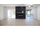 Living area with fireplace and sliding doors leading to a patio at 10118 Allenby Ct, Orlando, FL 32821