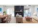 Spacious living room with a fireplace, large windows, and plenty of natural light at 10118 Allenby Ct, Orlando, FL 32821