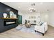 Spacious living room with modern fireplace, cozy seating, and an open layout for easy entertaining at 10118 Allenby Ct, Orlando, FL 32821