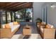 Relaxing screened patio with wicker furniture and access to backyard at 10118 Allenby Ct, Orlando, FL 32821
