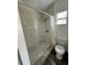 Updated bathroom with a shower and toilet at 1142 Grayson Dr, Orlando, FL 32825
