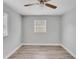 Simple bedroom with a window and ceiling fan at 1142 Grayson Dr, Orlando, FL 32825