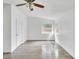 Spacious bedroom with wood-look floors and ceiling fan at 1142 Grayson Dr, Orlando, FL 32825