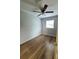 Bright bedroom with ceiling fan and wood-look flooring at 1142 Grayson Dr, Orlando, FL 32825